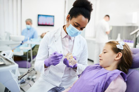 female dentist with young patient