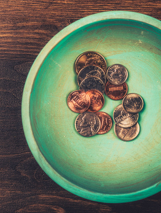 coins in a green dish
