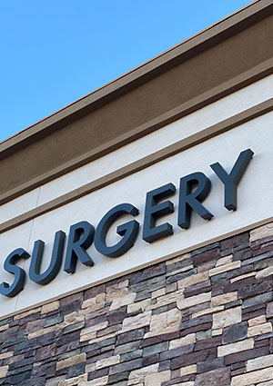 closeup of the word surgery on a building exterior